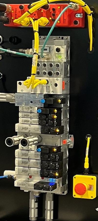 The Allen-Bradley ArmorBlock Guard I/O, top center, is wired to a CPX with VTSA-F-CB valve terminal, bottom center, for three safe zones and up to a CAT3, Ple, and SIL3 safety level.