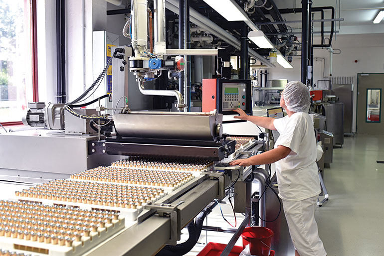 After using leak detection guns and installing flow meters, a pneumatic system at a chocolate factory like this opens and closes faster, resulting in significantly higher production and fewer malfunctions.